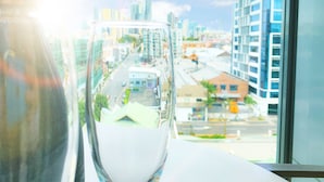 A view from a window with a clear sky and buildings in the distance. - Apartments on Connor (Fortitude Valley)