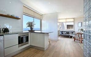 Studio (Blue Waters 2) | Private kitchen | Full-size fridge, oven, stovetop, electric kettle