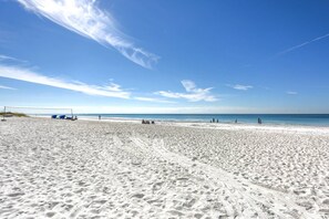 Beach nearby, beach umbrellas, motor boating