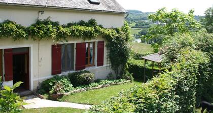 A Charming Small Farm House With a View of a Lake