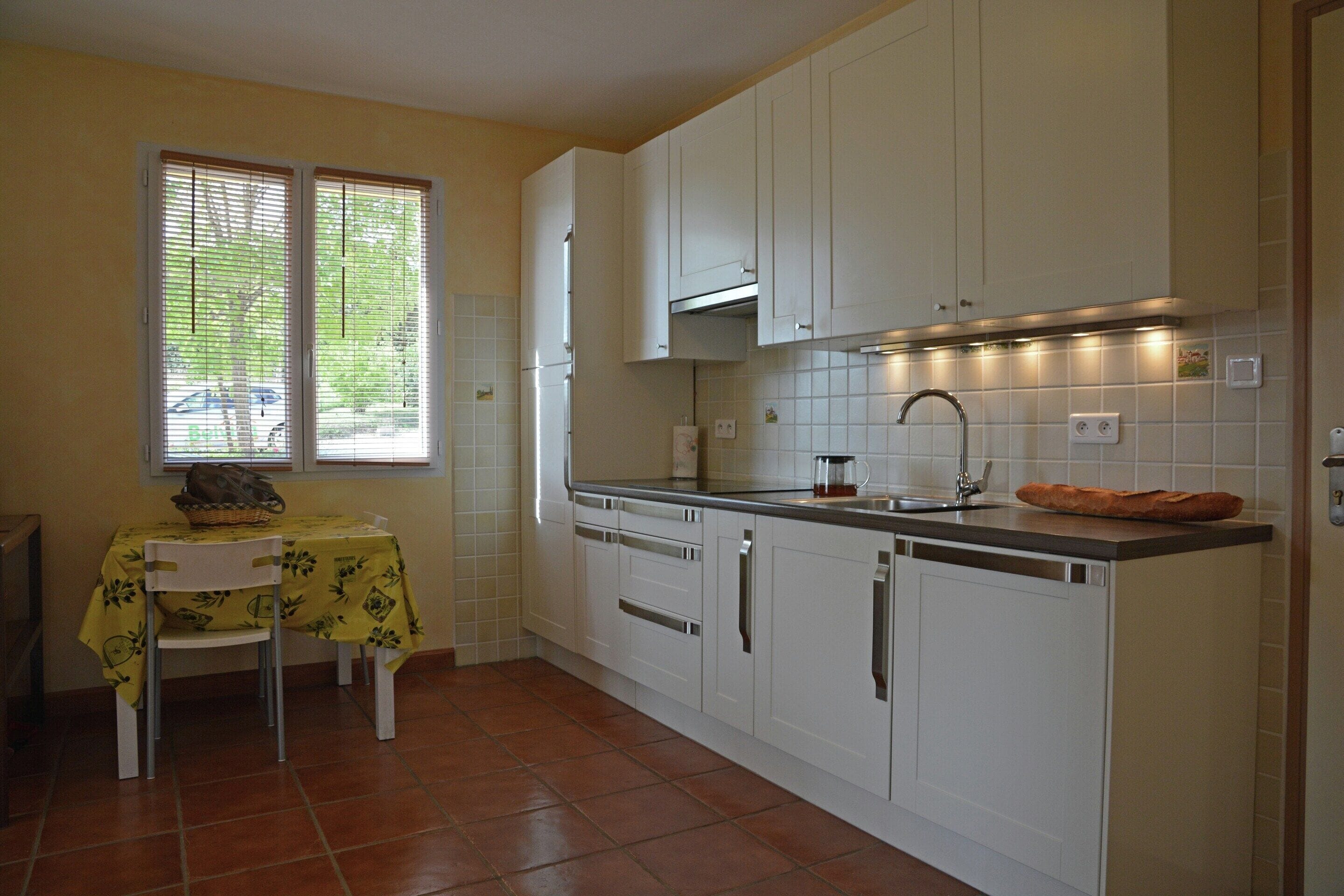 Villa | Private kitchen | Fridge, microwave, stovetop, high chair