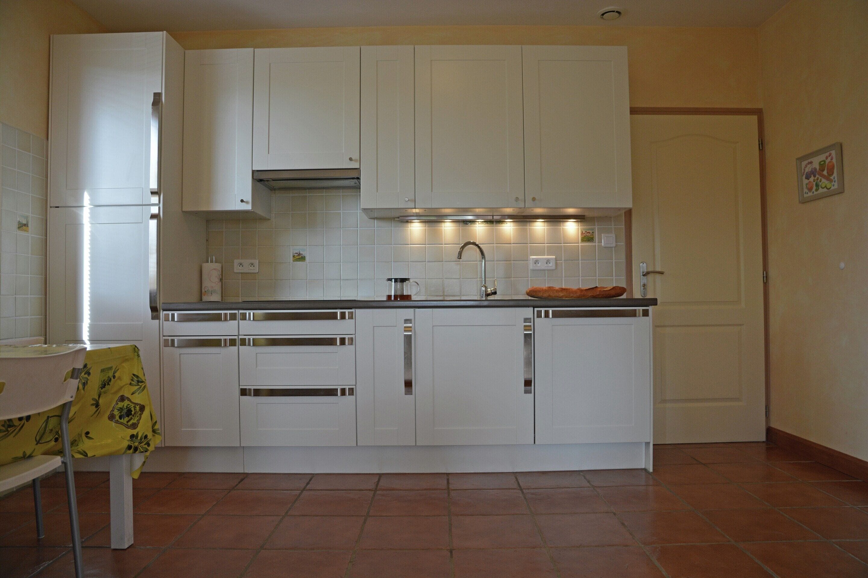 Villa | Private kitchen | Fridge, microwave, stovetop, high chair