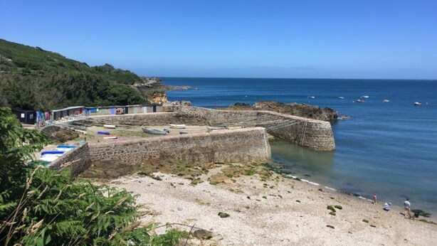 A coastal area with stone walls, a beach, and boats. - House Near Merlimont-plage and Historic Abbey (Gouy-Saint-Andre)