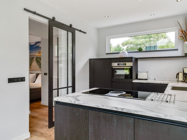 House | Private kitchen | High chair - Attractive Holiday Home With Sauna (De Koog)