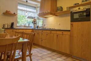 House | Private kitchen | Highchair - Cosy Vacation Home With a Garden (Sint Anthonis)