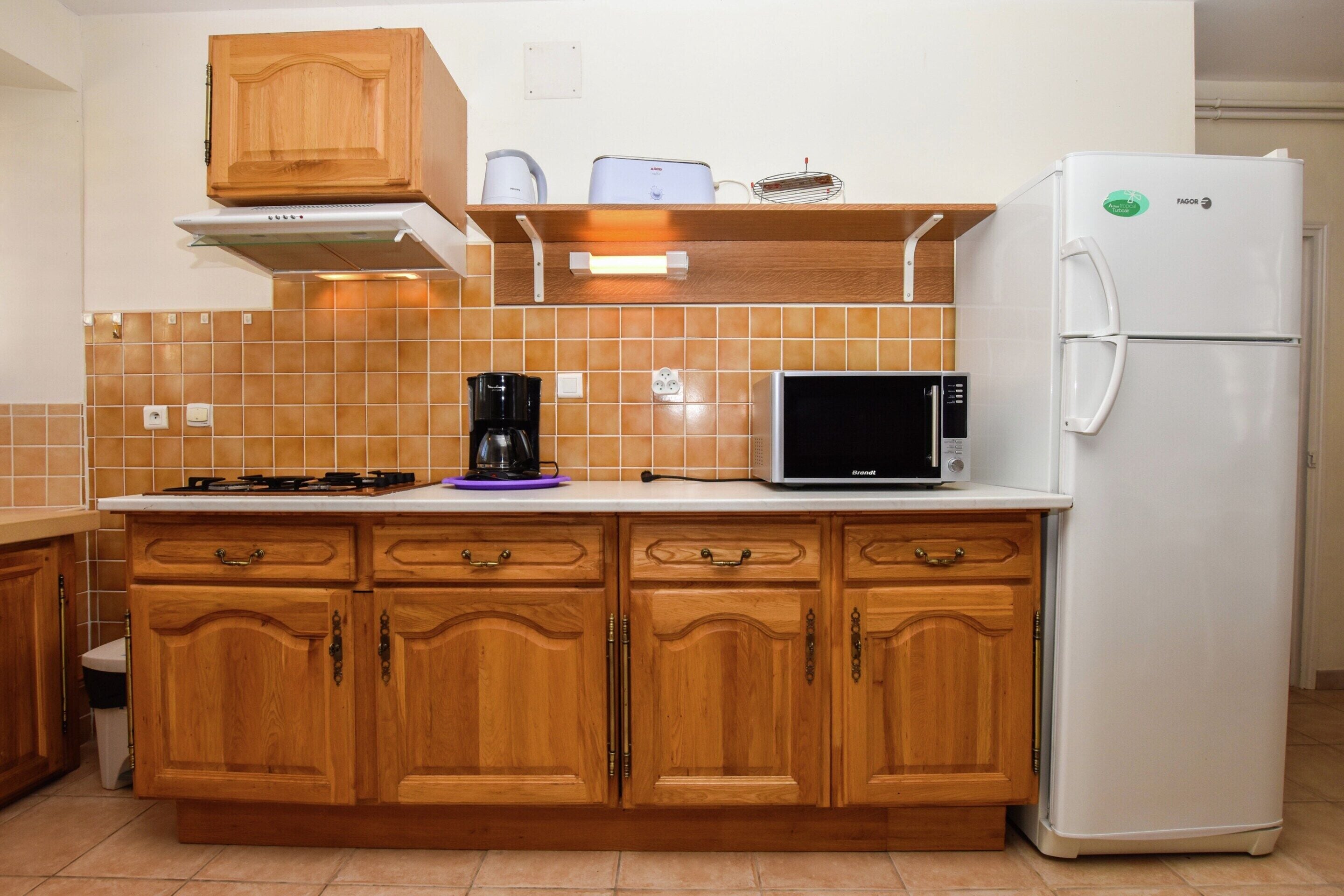 Casa | Cocina privada | Frigorífico y cafetera o tetera