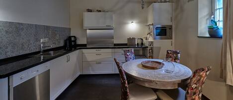 Appartement | Cuisine privée | Chaise haute