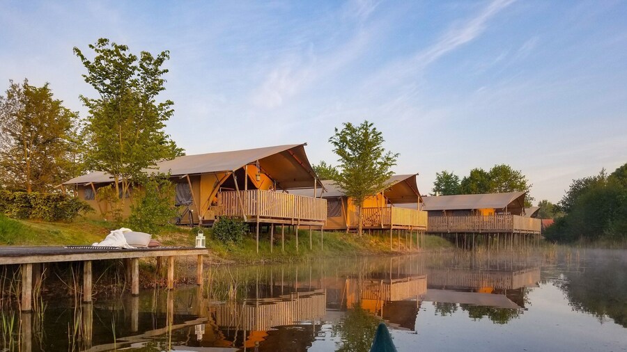 Campsite - Combined Tents With Kitchen and Bathroom Located Near a Pond
