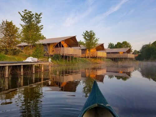 Campsite - Combined Tents With Kitchen and Bathroom Located Near a Pond
