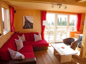 Chalet | Living room | Fireplace, DVD player - Spacious Chalet near Ski Area in Wolfsberg (Bad Sankt Leonhard im Lavanttal)