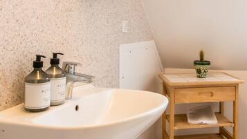 Shower, rainfall showerhead, hair dryer, towels