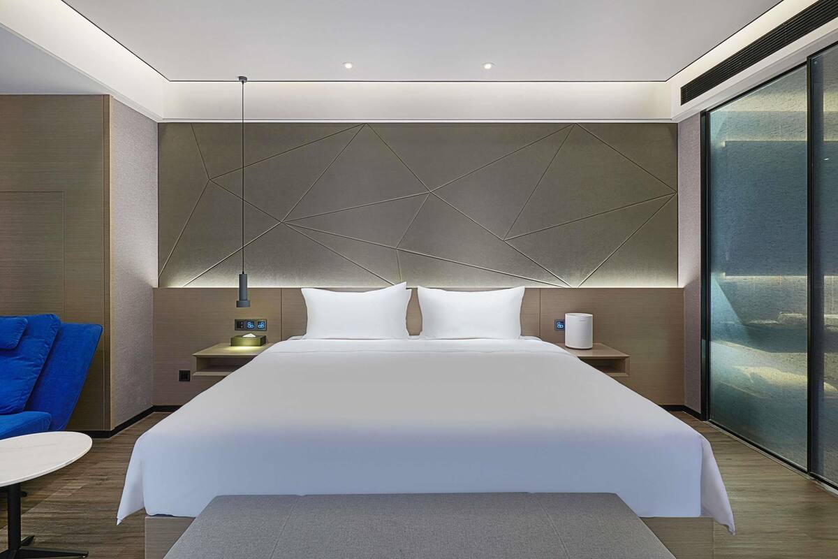 Chambre Deluxe, 1 très grand lit | Espace de travail pour ordinateur portable, Wi-Fi gratuit, draps fournis