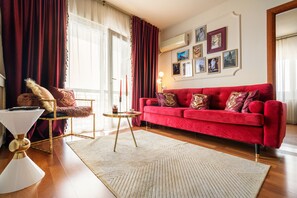 Deluxe Apartment, 2 Bedrooms, Balcony, City View | Living area | 110-cm Smart TV with digital channels, TV, Netflix