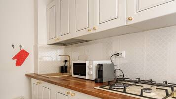 Deluxe Apartment, 2 Bedrooms, Balcony, City View | Private kitchen | Dining tables