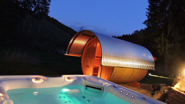 A hot tub with a metallic structure in the background. - "All alone" relax without neighbors and other guests   (Sevenig / Our)
