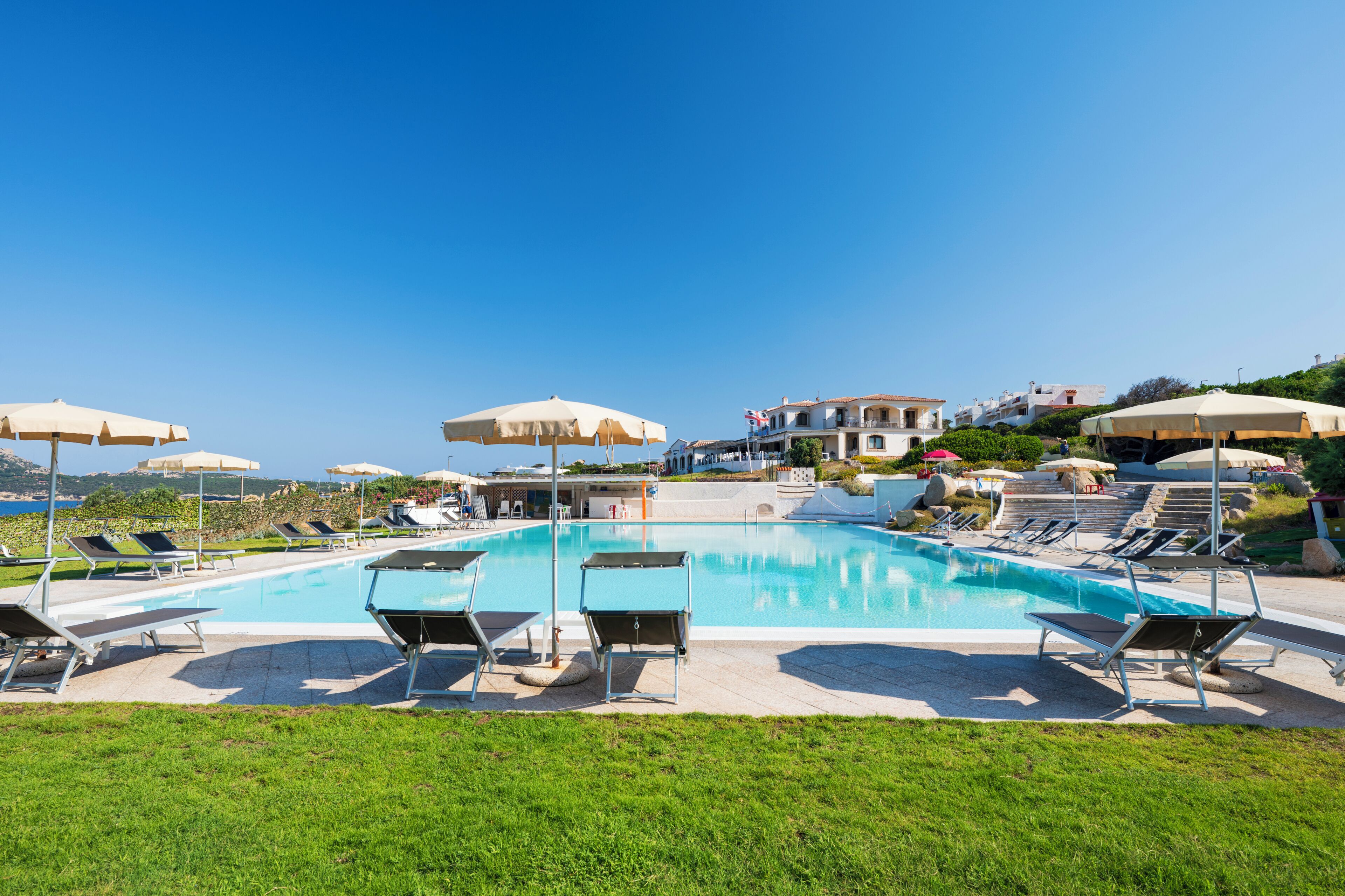 Seasonal outdoor pool, pool umbrellas, pool loungers