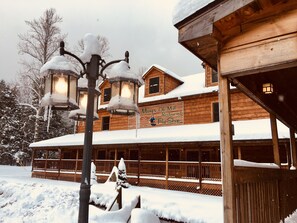 A wooden building with a sign for 'May's Ole Mill Restaurant and Fly Shop'. - Elk Springs Resort (Monterville)