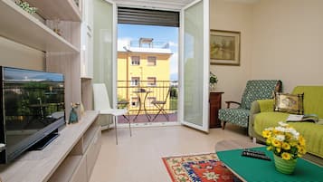 Family Apartment, 2 Bedrooms (Villa Mimosa - Appartamento 2) | Living area | 22-inch flat-screen TV with satellite channels, TV