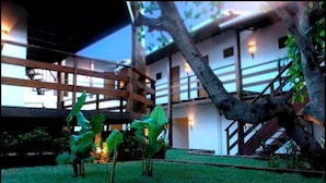 A building with a wooden balcony and a staircase. - All Blue (Jijoca de Jericoacoara)