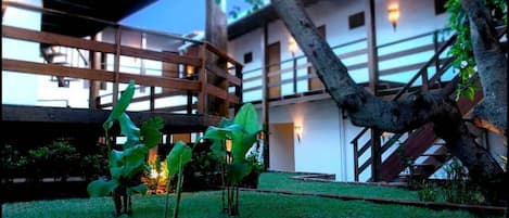 A building with a wooden balcony and a staircase.