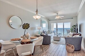 Enjoy meals at the round dining table with comfortable seating for all.