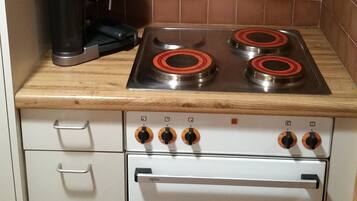 Fridge, oven, stovetop, dining tables