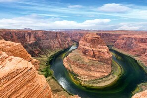 A canyon with a river winding through it.