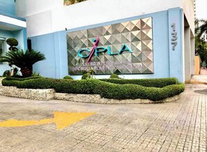 A building with a blue facade and a sign reading "CPLA".