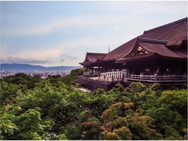 A traditional Japanese building with a view of a cityscape in the background.