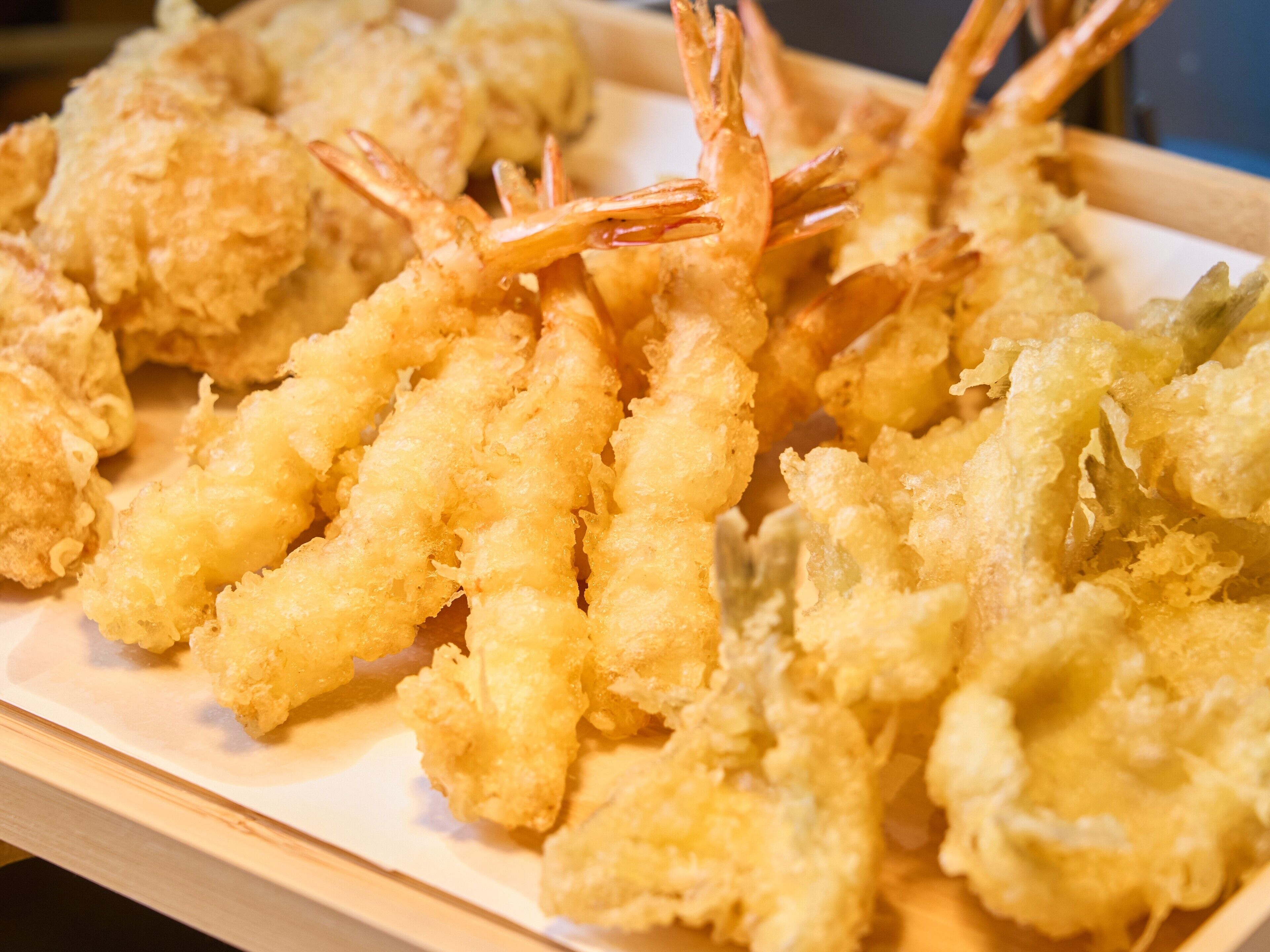 A tray of fried shrimp and other seafood items.