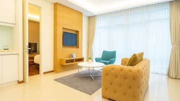 Deluxe One-Bedroom Suite | Living area | 40-inch Smart TV with digital channels, Netflix, streaming services