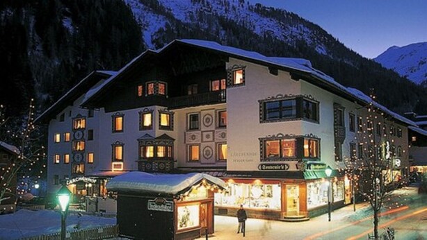 A large, multi-story hotel with a snow-covered roof and multiple windows, located in a mountainous area. - Appartement Christine by Skinetworks (Sankt Anton am Arlberg)