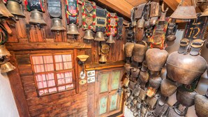 A room with wooden walls, a wooden door with glass panels, and a red carpet. - Heart Hotel Talhoff Nigg (Sankt Anton am Arlberg)