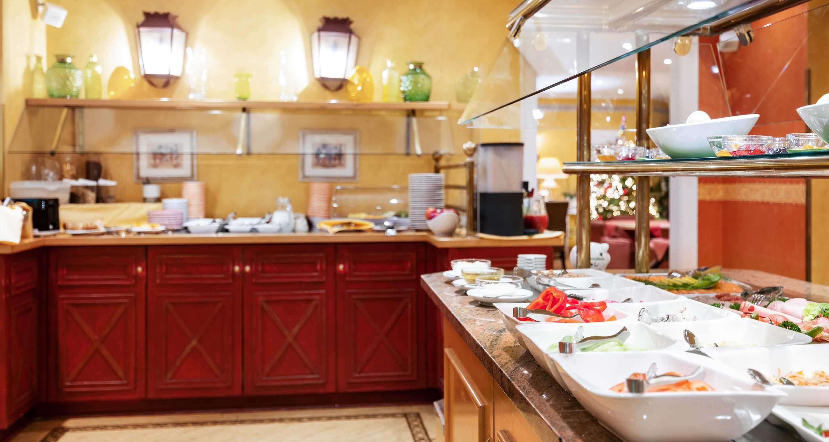 A buffet setup with various food items and a counter.
