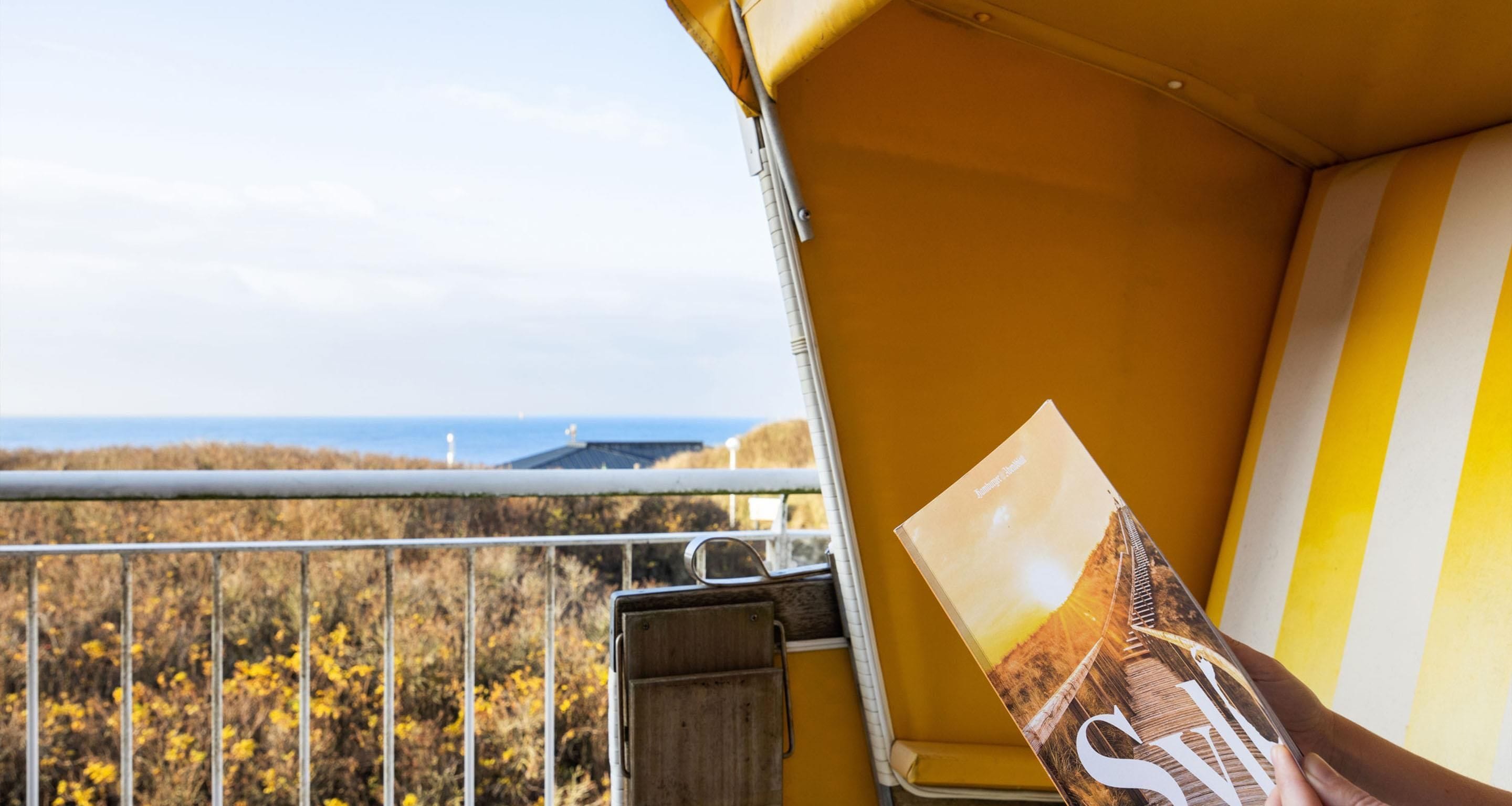 A yellow vehicle with a view of a coastal landscape.