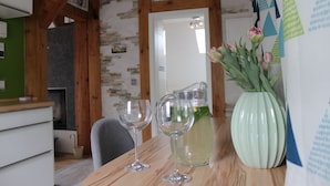A wooden table with a pitcher of lemonade and two empty wine glasses. - Vacation on the pony farm (Priborn)