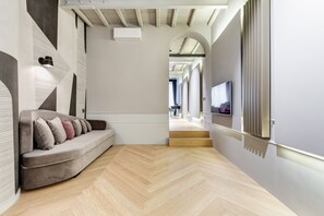 Appartement Deluxe, 2 chambres | Coin séjour | Télévision à écran plat