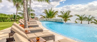 Air-conditioned condo w/ lovely ocean views, beach access, shared pools