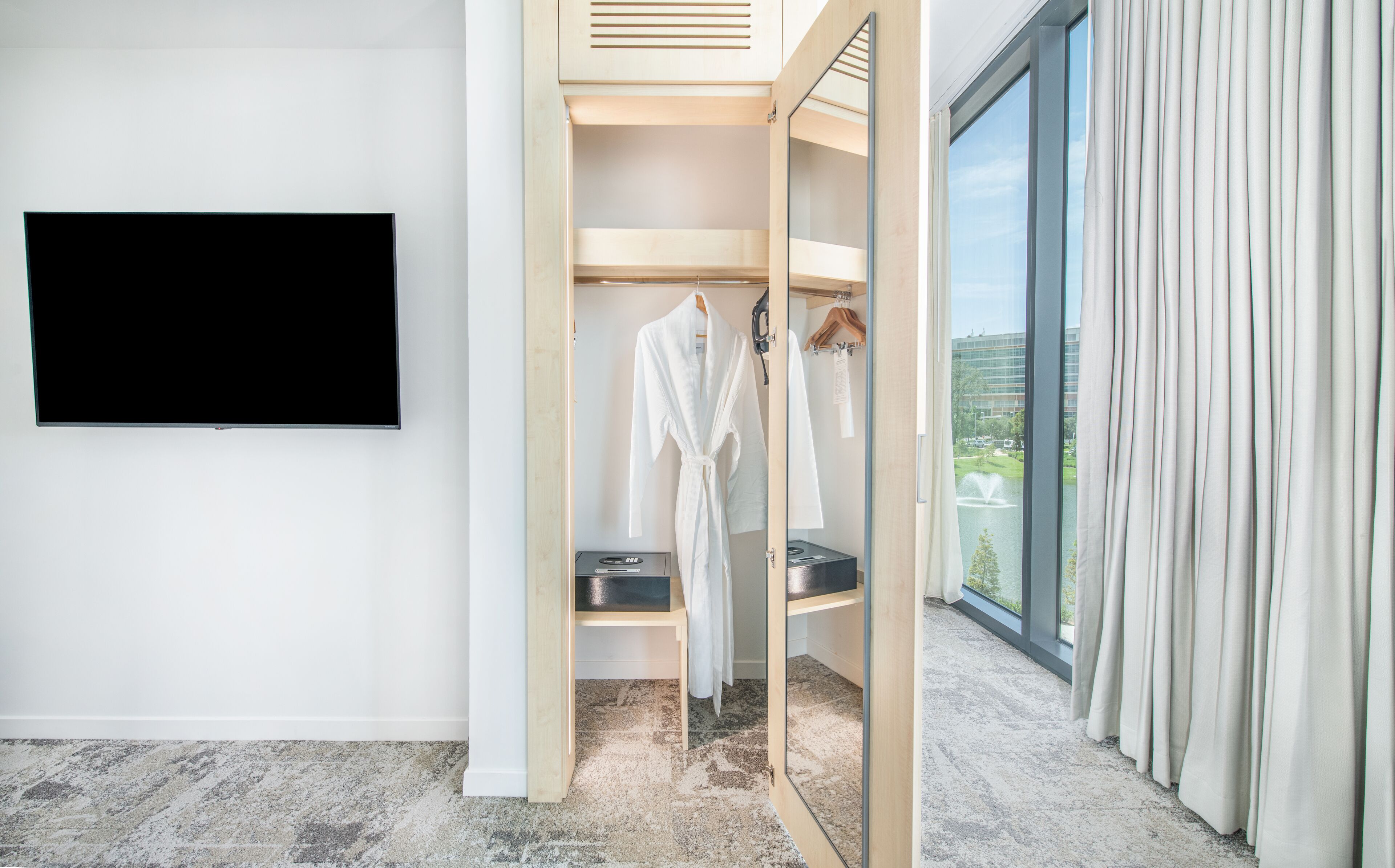 suite, lake view | in-room safe, desk, iron/ironing board, free wifi