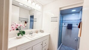Shower, hair dryer, towels, soap
