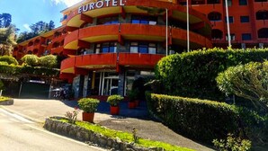 A multi-story hotel with balconies and a sign reading "EUROTEL".