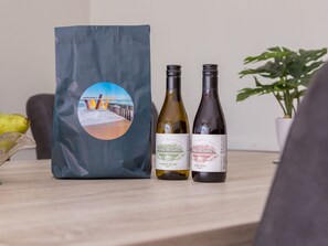 A bag and two bottles of wine on a table. - Apartment in Flushing Near Vlissing Beach (Vlissingen)