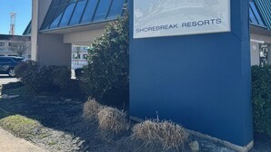 A sign for Impala Island Inn, indicating it is a Shorebreak Resorts property. - Impala Island Inn (Ocean City)