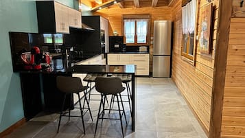 Chalet | Private kitchen | Fridge, highchair