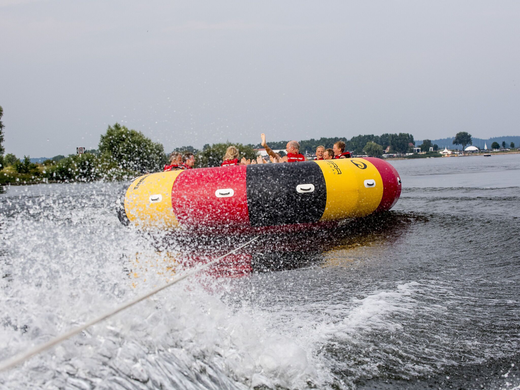A water tube with people enjoying the ride.