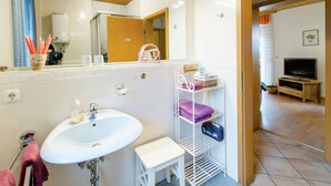 House | Bathroom | Shower, hair dryer, towels - Modern Holiday Home in Beckedorf With Terrace (Südheide)