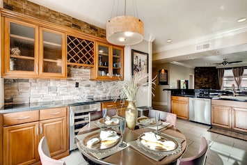 Elegant dining room with wine and beverage center.