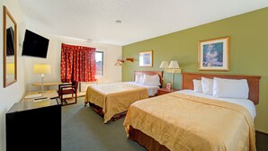 A hotel room with two beds, a desk with a chair, a TV, and a window with curtains. - Capital O Amerihost Inn and Suites Kingdom City Hwy 54 MO (Kingdom City)