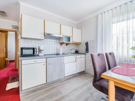 Apartment | Private kitchen | Stovetop, highchair