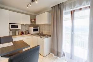 Standard Apartment | Living area | Flat-screen TV